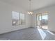 Bright dining room featuring tile floors and sliding glass doors at 16405 W Desert Mirage Dr, Surprise, AZ 85388