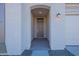 Covered entryway with arched entry and neutral-colored walls at 16405 W Desert Mirage Dr, Surprise, AZ 85388