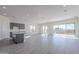 Bright and spacious living room with tile flooring and sliding glass doors at 16405 W Desert Mirage Dr, Surprise, AZ 85388