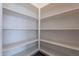 Spacious pantry with ample shelving for storage at 16405 W Desert Mirage Dr, Surprise, AZ 85388