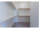 Spacious walk-in closet, offering ample storage with shelves and hanging rods at 16405 W Desert Mirage Dr, Surprise, AZ 85388