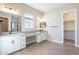 Main bathroom with double vanity, walk-in shower, and large mirror at 16430 W Desert Mirage Dr, Surprise, AZ 85388