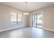 Bright dining area with sliding door access to patio at 16430 W Desert Mirage Dr, Surprise, AZ 85388