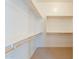 Large walk-in closet with ample shelving and hanging rods at 16430 W Desert Mirage Dr, Surprise, AZ 85388