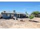 House back view with solar panels and a covered patio at 4833 N 69Th Dr, Phoenix, AZ 85033