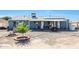 House back view, showcasing solar panels and a covered patio at 4833 N 69Th Dr, Phoenix, AZ 85033