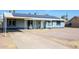 House front view with solar panels and a carport at 4833 N 69Th Dr, Phoenix, AZ 85033