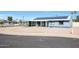 House front view, showcasing solar panels and a carport at 4833 N 69Th Dr, Phoenix, AZ 85033