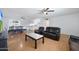 Living room with hardwood floors and black leather furniture at 4833 N 69Th Dr, Phoenix, AZ 85033