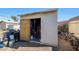 Exterior of a storage shed with various items stored around it at 4833 N 69Th Dr, Phoenix, AZ 85033