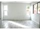 Bright bedroom featuring tile floors, fresh paint, and natural light from multiple windows at 15463 W Mescal St, Surprise, AZ 85379