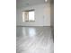 Inviting living room with light-colored flooring, natural light and a white door at 15463 W Mescal St, Surprise, AZ 85379