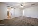 Bright bedroom with carpet and barn door at 7088 W Redbird Rd, Peoria, AZ 85383