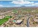Beautiful aerial view of a golf course community with mountain views at 9853 E Sundance Trl, Scottsdale, AZ 85262