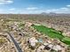 Scenic aerial view of the neighborhood, golf course, and mountain views at 9853 E Sundance Trl, Scottsdale, AZ 85262