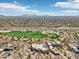Scenic aerial view of the neighborhood, golf course, and mountain views at 9853 E Sundance Trl, Scottsdale, AZ 85262