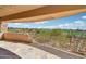 Outdoor patio space offering unobstructed views of the desert landscape and golf course at 9853 E Sundance Trl, Scottsdale, AZ 85262