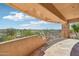 Covered back patio overlooks the golf course and pool area with mountain views at 9853 E Sundance Trl, Scottsdale, AZ 85262