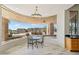 Bright breakfast nook with panoramic windows offering views of desert landscaping and mountains at 9853 E Sundance Trl, Scottsdale, AZ 85262