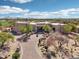 Stunning desert home featuring an expansive brick driveway and gorgeous desert landscaping at 9853 E Sundance Trl, Scottsdale, AZ 85262