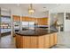 Spacious kitchen island features custom cabinets, stainless steel appliances and modern lighting at 9853 E Sundance Trl, Scottsdale, AZ 85262