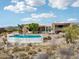 Resort-style home featuring a large private pool and stunning desert landscape at 9853 E Sundance Trl, Scottsdale, AZ 85262