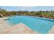 Clear blue water stretches across backyard pool overlooking views of desert landscape and a golf course at 9853 E Sundance Trl, Scottsdale, AZ 85262