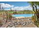 Inviting pool with gorgeous golf course views and desert landscaping at 9853 E Sundance Trl, Scottsdale, AZ 85262