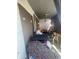 Enclosed back porch filled with assorted household items and furniture at 1006 S 3Rd Ave, Phoenix, AZ 85003