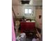 Interior view of a cluttered bathroom with a toilet, sink, and miscellaneous items scattered around at 1006 S 3Rd Ave, Phoenix, AZ 85003