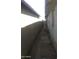 Narrow exterior alleyway between two homes at 1006 S 3Rd Ave, Phoenix, AZ 85003