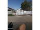 View of exterior with metal fencing surrounding the property and a small home at 1006 S 3Rd Ave, Phoenix, AZ 85003