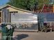 A view of a home's front yard with metal fence, a green trash bin and some items on the ground at 1006 S 3Rd Ave, Phoenix, AZ 85003
