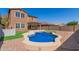 A backyard with a pool, patio, and rocks that make it look beautiful at 12687 W Caraveo Pl, Peoria, AZ 85383