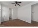 Bedroom featuring neutral walls, brown carpet, and a closet at 12687 W Caraveo Pl, Peoria, AZ 85383