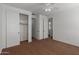 Bedroom with a closet and entry door offers ample space and storage at 12687 W Caraveo Pl, Peoria, AZ 85383