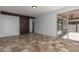 Bright room with decorative sliding barn door to separate space, and backyard access at 12687 W Caraveo Pl, Peoria, AZ 85383