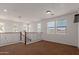 The open loft features bright, natural light with its ample windows and views at 12687 W Caraveo Pl, Peoria, AZ 85383