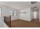 Upstairs loft area with neutral walls, brown carpet, and shelf at 12687 W Caraveo Pl, Peoria, AZ 85383