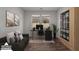 This home office features a sleek desk, comfortable seating, and ample storage in a naturally lit space at 12687 W Caraveo Pl, Peoria, AZ 85383