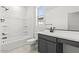 Modern bathroom features a tub, neutral vanity, and tiled flooring at 18174 W Pima St, Goodyear, AZ 85338