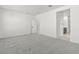 The Primary bedroom is spacious with neutral carpeting and white walls, ready for personalization at 18174 W Pima St, Goodyear, AZ 85338