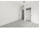 Bright bedroom with neutral carpet, white walls, and closet at 18174 W Pima St, Goodyear, AZ 85338