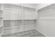 Large walk-in closet with built-in shelving offers plenty of storage space at 18174 W Pima St, Goodyear, AZ 85338