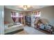 Simple bedroom with neutral colors and comfortable furnishings at 2124 W Maricopa St, Phoenix, AZ 85009