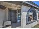 Close up of front porch featuring arched entryway, security door, and statues at 2124 W Maricopa St, Phoenix, AZ 85009
