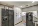 Bright kitchen featuring lots of cabinet storage and multiple refrigerators at 2124 W Maricopa St, Phoenix, AZ 85009