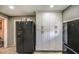 Kitchen featuring lots of storage space and a large refrigerator at 2124 W Maricopa St, Phoenix, AZ 85009