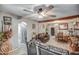 Bright living room with hardwood floors, ceiling fan, and open floor plan at 2124 W Maricopa St, Phoenix, AZ 85009