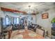 Open-concept living room and dining area with chandelier and hardwood floors at 2124 W Maricopa St, Phoenix, AZ 85009